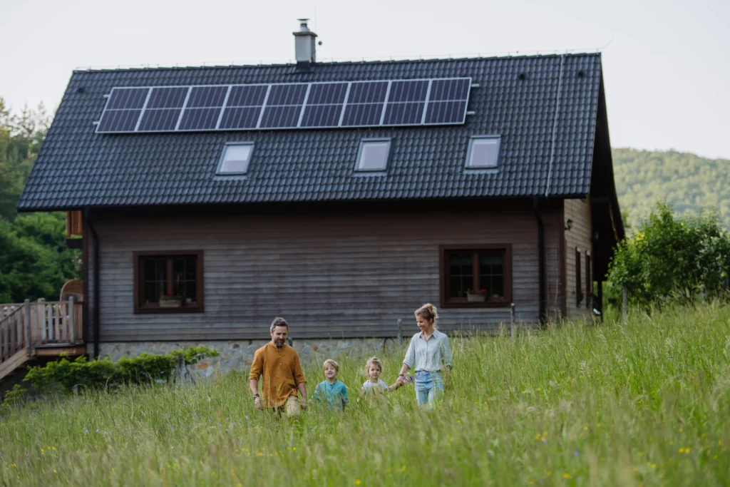 family-walking-near-a-rural-home-on-grassy-hill-2026-09-22-18-34-54-utc_result